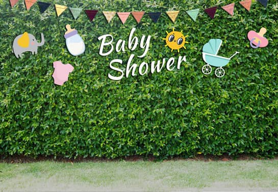 baby shower decorated hedge with thematic decorations and the phrase Baby Shower