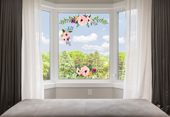 Bay window with flower stickers and white curtains