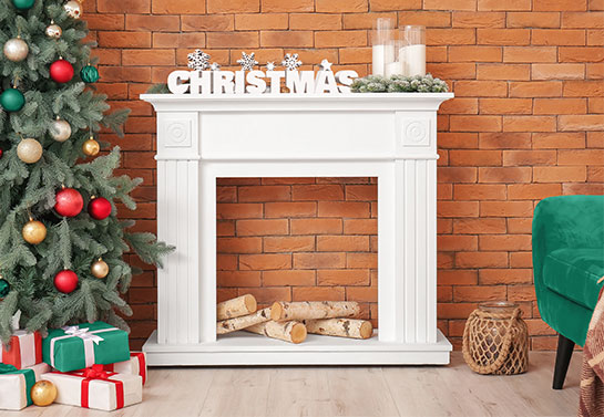 White decoration on the mantelpiece in the style of celebrity Christmas decorations