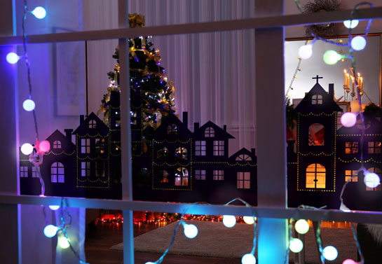 Christmas window decoration idea with a magic winter town view sticker
