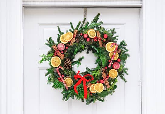 office door wreath for Christmas with dried oranges