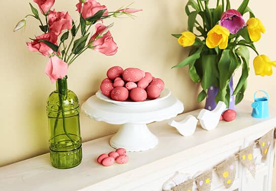 Easter mantel decorating idea with red eggs and flowers