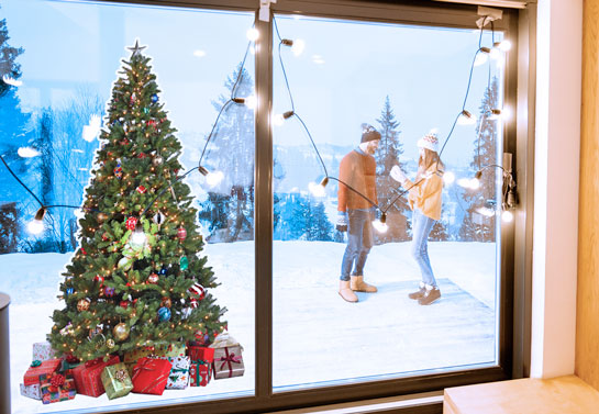 Christmas window decoration Realistic with a sticker of Christmas tree 