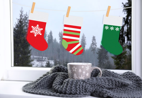 Christmas window decoration idea with Santa stockings