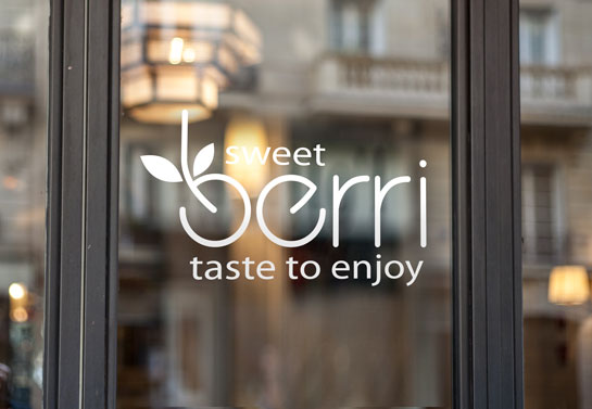 Sweet Berri business window decor with logo and slogan