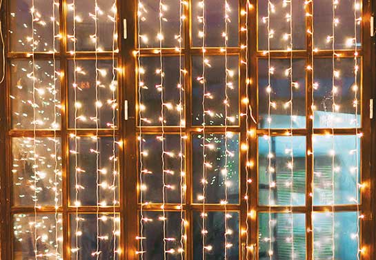 simple office Christmas decoration idea with light cords for windows 