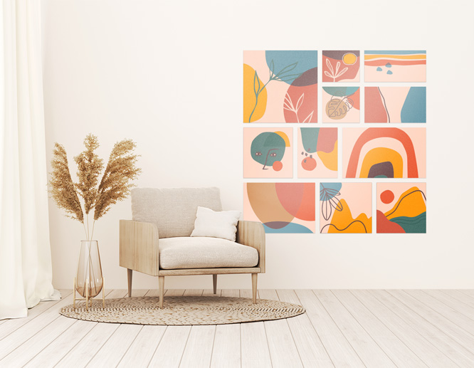 A collage of abstract living room vinyl wall art next to an armchair