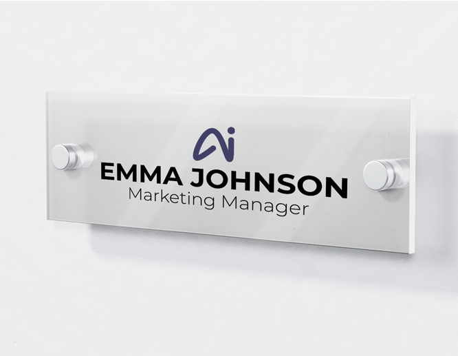 Acrylic flat sign installed on the wall and reading the marketing manager's name