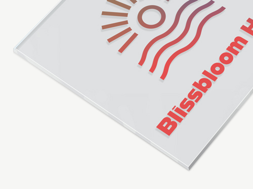 Close-up of an acrylic sign showing part of a hotel logo and name for hospitality use.