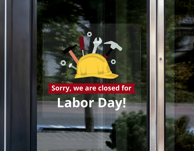 Transparent we are closed for Labor Day sign with an illustration adhered to the window
