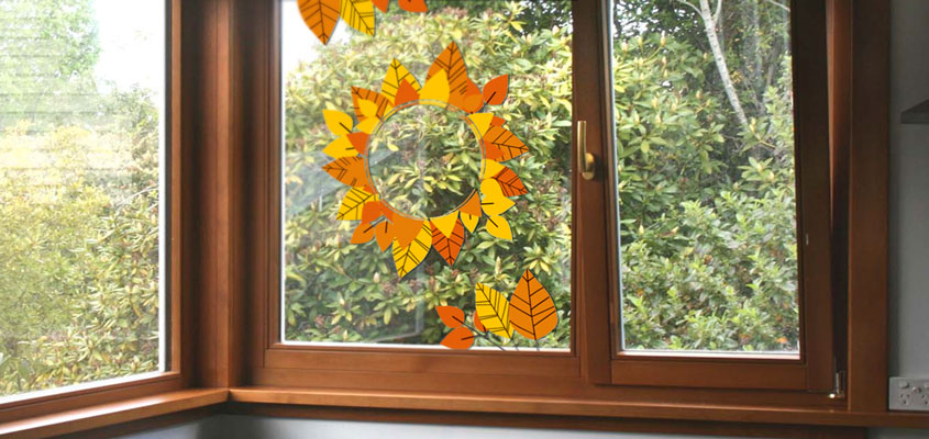 autumn themed home window decorating idea with decals