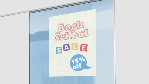 Back to school 15% off window decal on a checkered background.