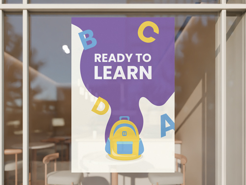 Colorful back to school sign featuring Ready to Learn text with letters and backpack.