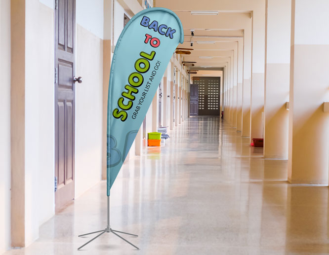 Blue welcome back to school teardrop flag installed in the corridor