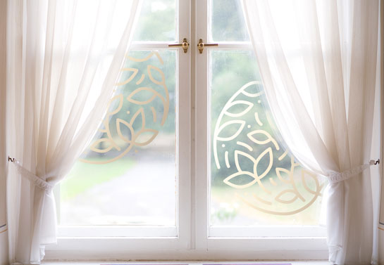 bay window decorating idea with curtains and decals