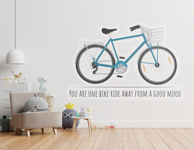 A bedroom wall decal portraying a blue bicycle and a motivational quote