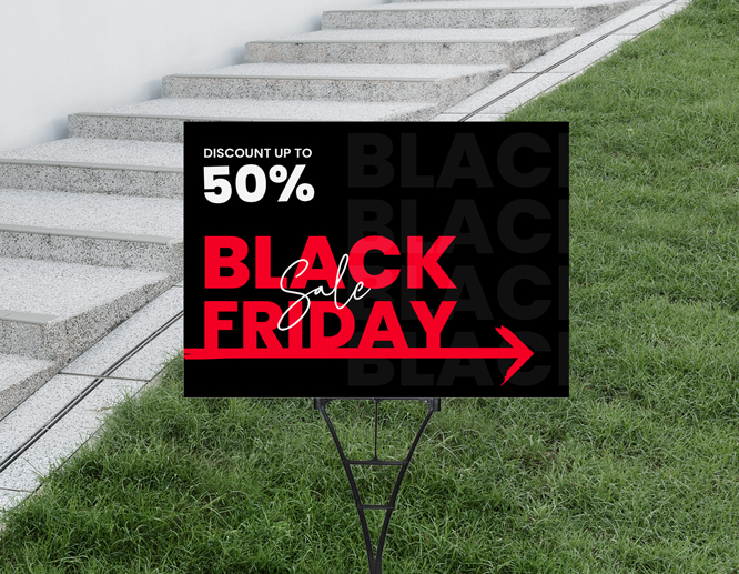 A black yard sign with a spider stake with red and white texts announcing a Black Friday sale.