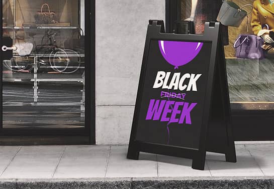Free-standing Black Friday Week sign with white and violet graphics