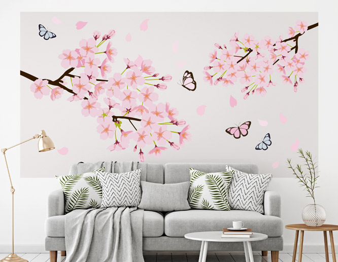 pink peel and stick wall art with cherry blossom illustration applied on a living-room wall