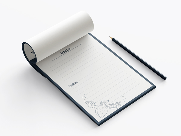 Notepad printing in blue and white featuring a to do list and notices with a pen beside