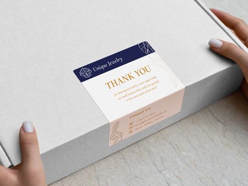 Branded die cut sticker with the company name, a "Thank You" note and contact information.