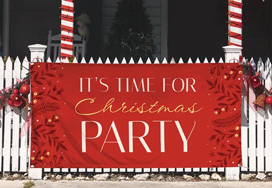 Red Christmas party banner on the fence