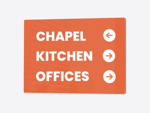 Church sign with white text and arrows pointing to congregation zones