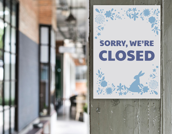 Small closed on Easter sign design with baby blue floral illustrations outlining the notice