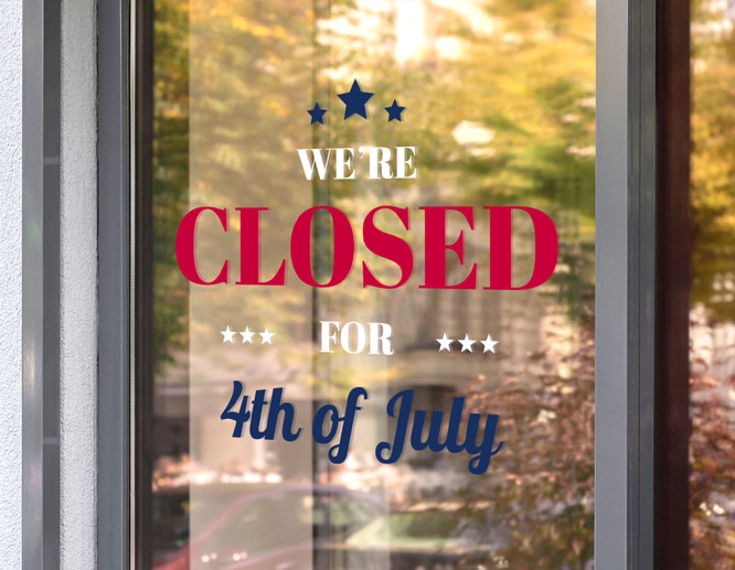 Glass-attached fourth of July closed sign with red, blue and white texts