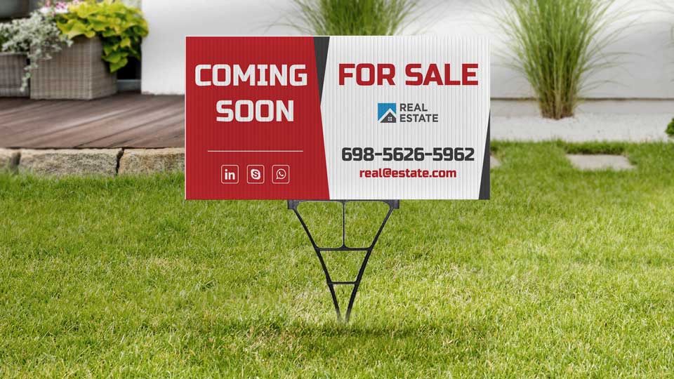 Coming soon real estate sign set up with a spider stake