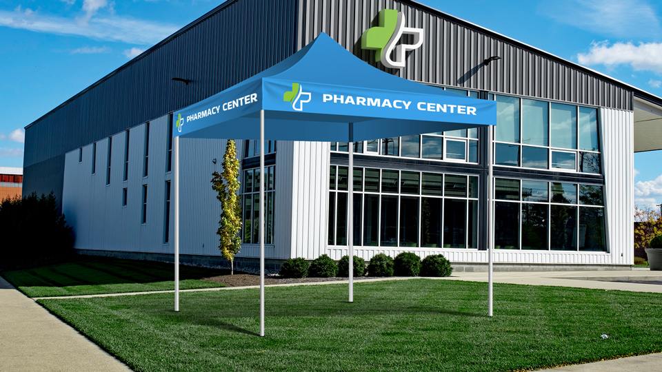 Pharmacy Center commercial canopy tent with a logo installed in front of a pharmacy