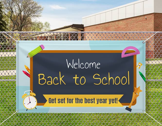 Large welcome back to school banner with a motivational quote installed on the fence