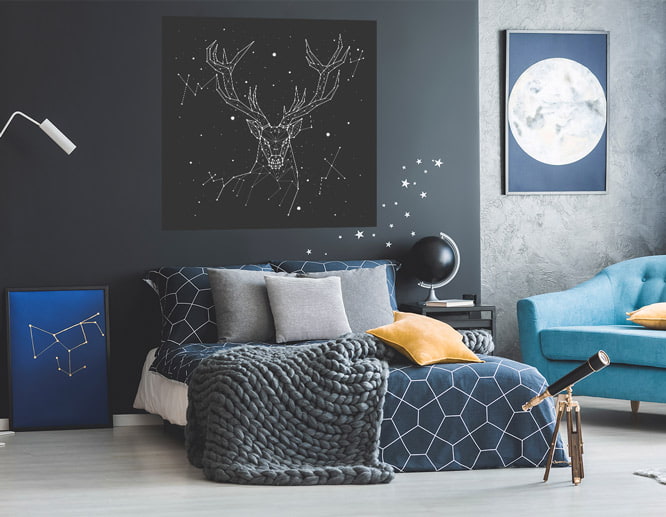 Constellation peel and stick wall decal for bedroom design placed over the bed