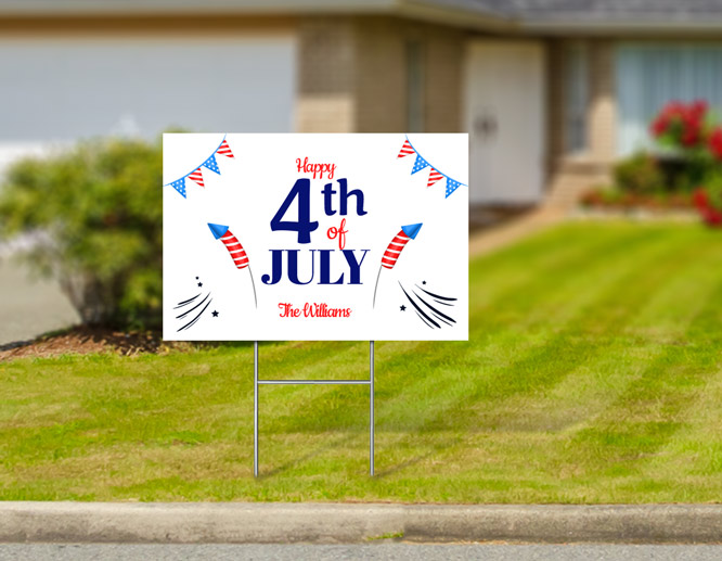 Happy 4th of July yard sign displaying fireworks and a family name placed by the house