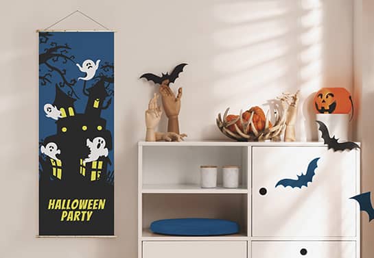 cute Halloween banner design in blue displaying a ghost house