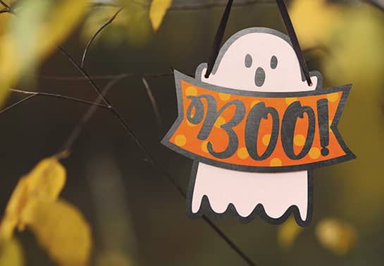 cute Halloween tree sign in white displaying the ghost character