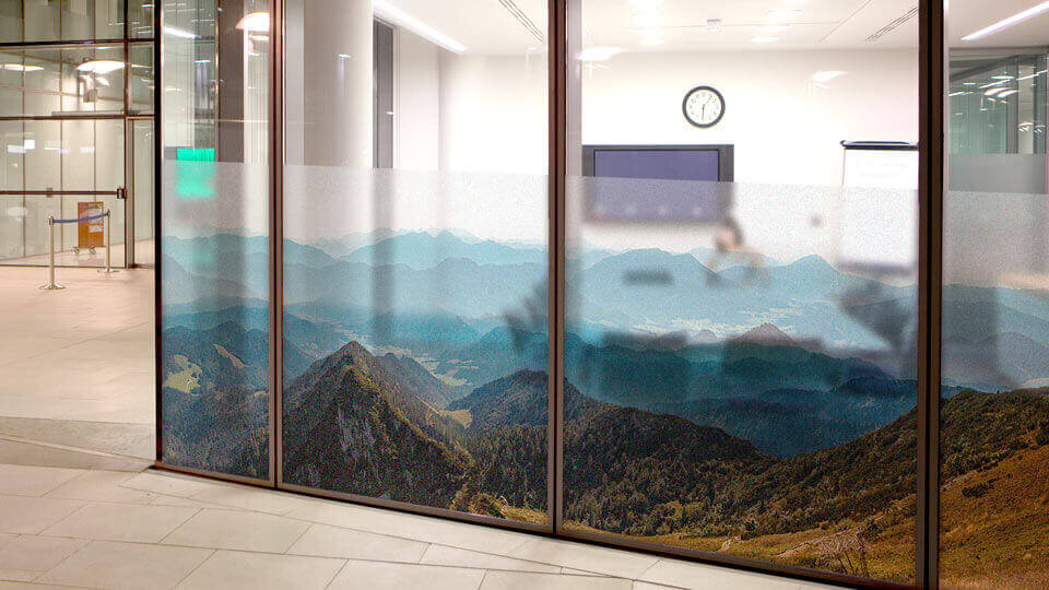 Frosted window decals with mountain landscapes for a meeting room