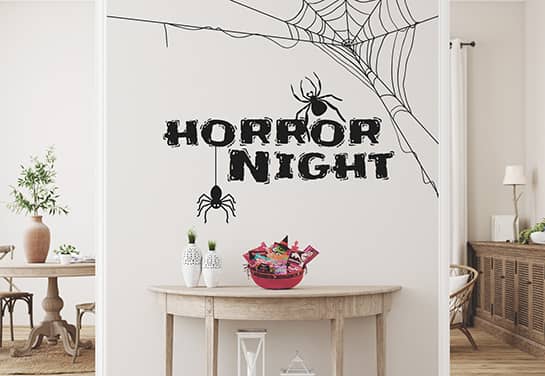 black Halloween wall sign with spider graphics