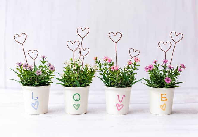 DIY Valentine's day decoration with heart-shaped wires placed in plant pots