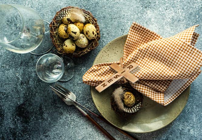 Easter wooden napkin ring with a shape of a cross and the word risen on it