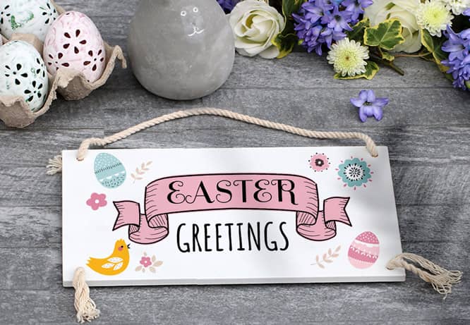 Cute Easter decorations with a vintage postcard that spell Easter Greetings