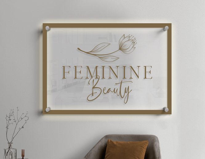 Beauty salon illuminated acrylic sign reading Feminine Beauty with a subtle image of a rose as a logo