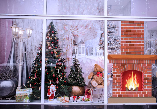 winter themed fireplace window decor for a business window