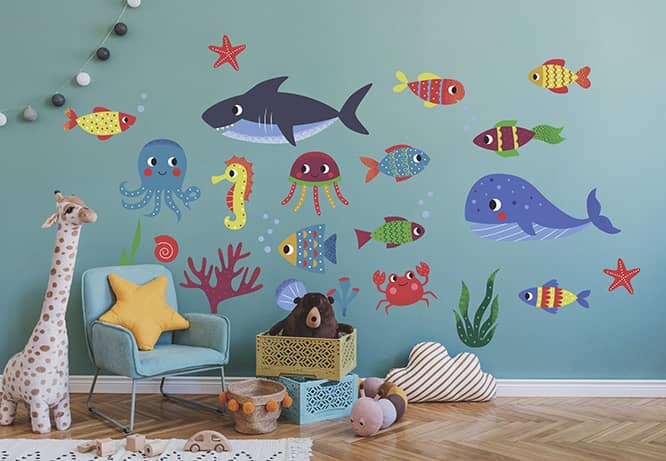 Children's room wall design idea with fish shapes graphics on a blue wall