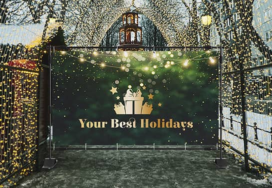 Exterior ground-mounted green and yellow banner with the text 'Your Best Holidays'