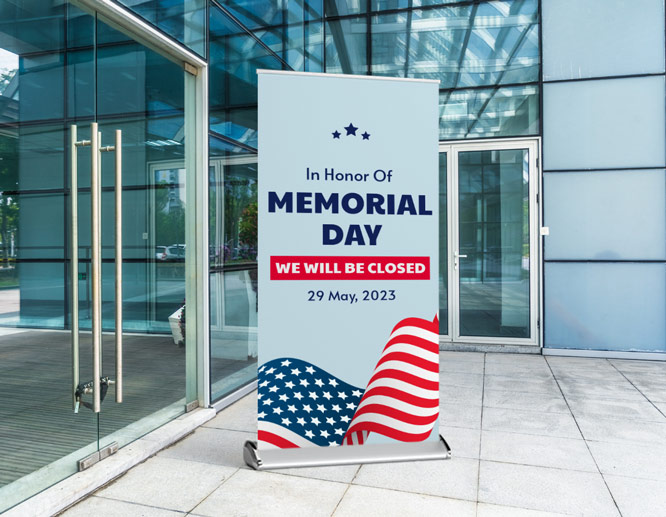 Free-standing Memorial Day closed sign with the US flag placed at the building entrance
