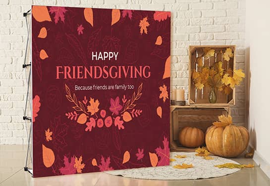 Happy Friendsgiving party backdrop in a deep red color