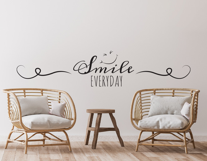 Joyful living room wall decal with lettering and graphics between two armchairs