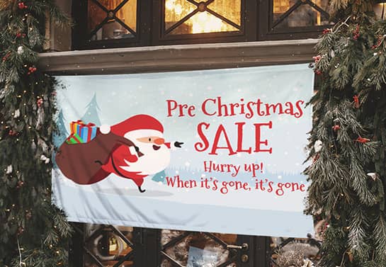 Pre-Christmas sale banner with funny Santa carrying a pile of gifts