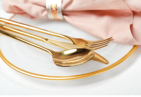 simple outdoor wedding decoration with golden cutlery